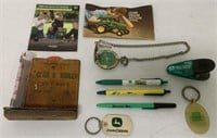 10 John Deere items- Rain Gauge, Pens, Catalog