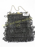 Satin lined black beaded purse, 7" x 6"