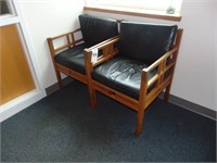 2 wooden chairs with leather cusions