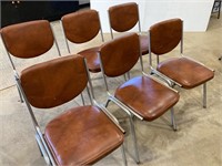 Chrome stacking chairs. Brown leatherette.