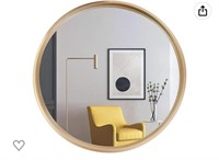 Circle mirror with gold ring living room wall