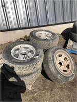 Five tires on rims. Four LT235/75R15 & one