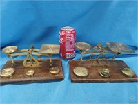 2 Brass scales with brass weights look at