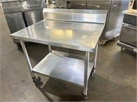 40” X 30” X 43”  Stainless Table W / Wheels