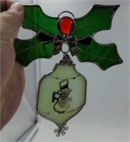 Handmade stained glass Christmas ornament. Holly