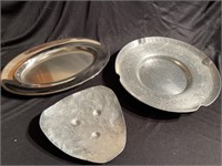 Two hammered aluminum trays and one tray made in