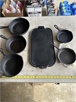 Set of six cast iron pans