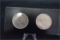 (2) EISENHOWER DOLLAR COINS WITH PLASTIC DISPLAY