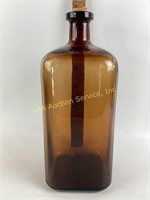 Tall square amber brown apothecary bottle