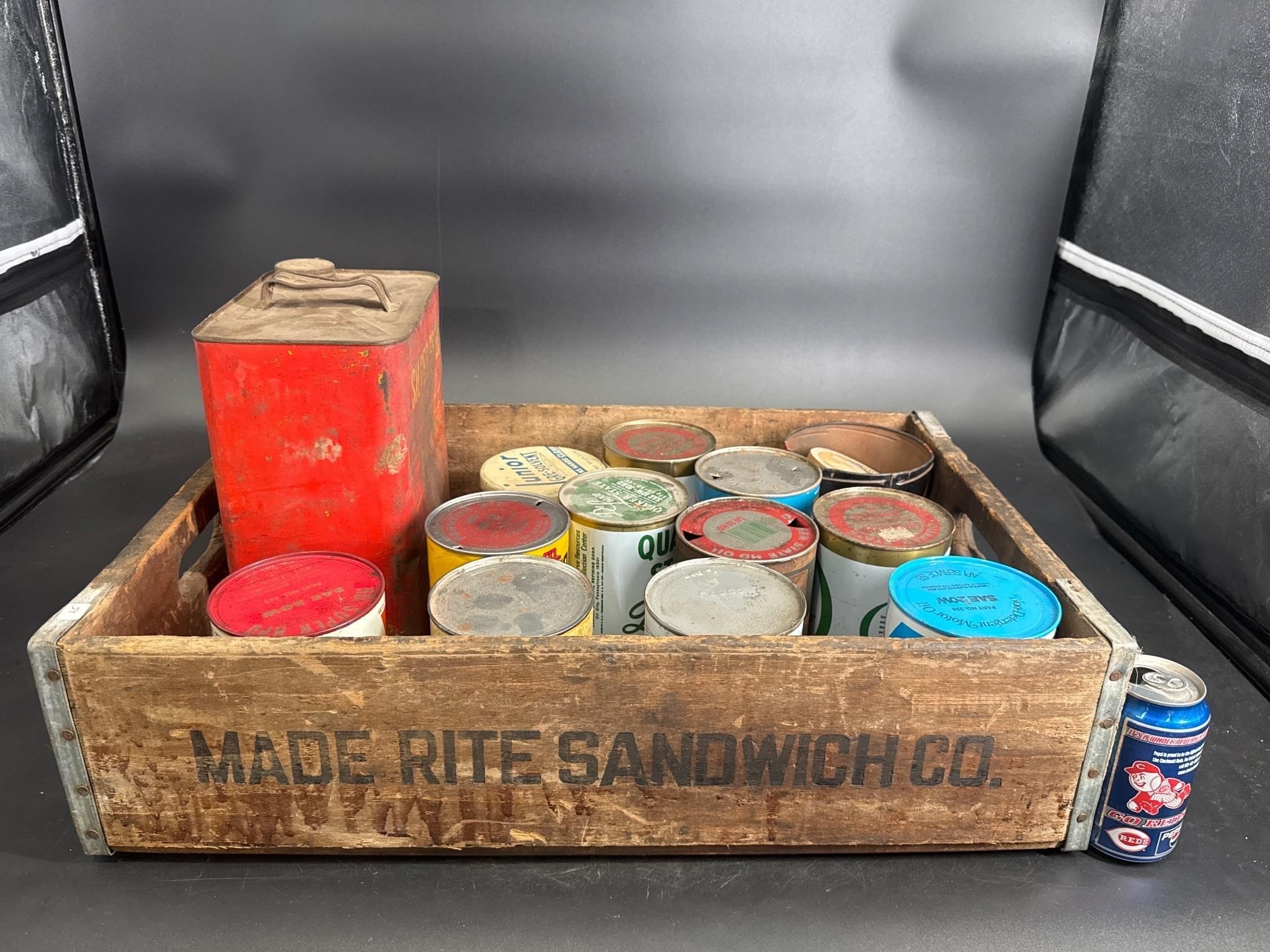 LOT OF 15 OIL CANS IN A WOOD CRATE FOR ONE MONEY