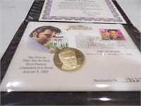 Elvis commemorative coin & first stamp