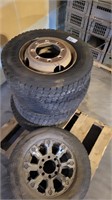 4 245/70R19.5 tires on rims, 1 LT275/65R18