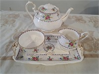 Tea pot, cream and sugar, damage on tea pot cover