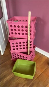 Three pink storage containers & small tub