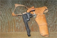 NOVELTY CERAMIC SIX GUN AND LEATHER HOLSTER