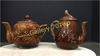 Pair of antique Bennington teapots-tallest is