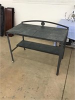 Super Metal and tile top potters table.  49 x 26