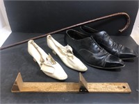 Wedding shoes, cane and shoe sizer. Shoes are
