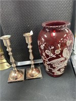 Ruby glass vase, metal candlesticks.