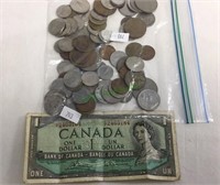 Bag of foreign  coins and a 1954 Canadian dollar,