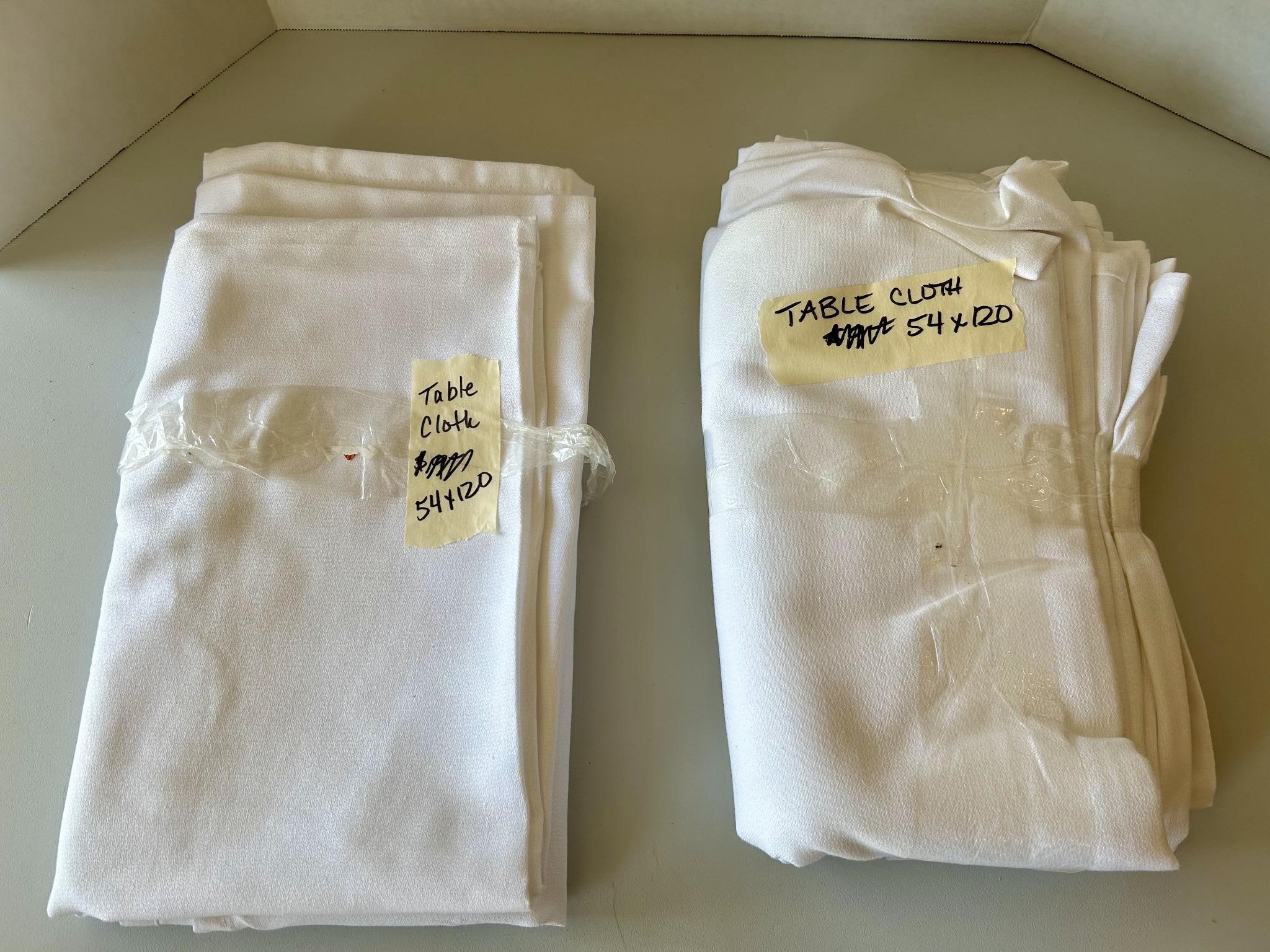 2 white table cloths unused  54x120