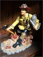 Firefighter racing to a fire resin figurine