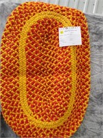 orange braided mat