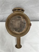 Early candle powered bicycle lamp