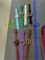 7 wrist watches as shown