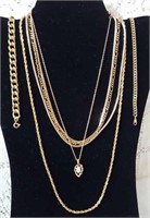 5 gold look chain necklaces and two bracelets
