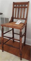 Childs antique cane bottom high chair