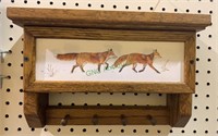 Oak shelf rack with  foxes in the snow plaque on
