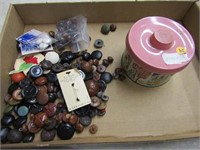 Tin of leather Buttons.