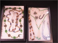 Two containers of beaded jewelry including