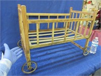 antique doll crib on wheels (just over 2ft long)