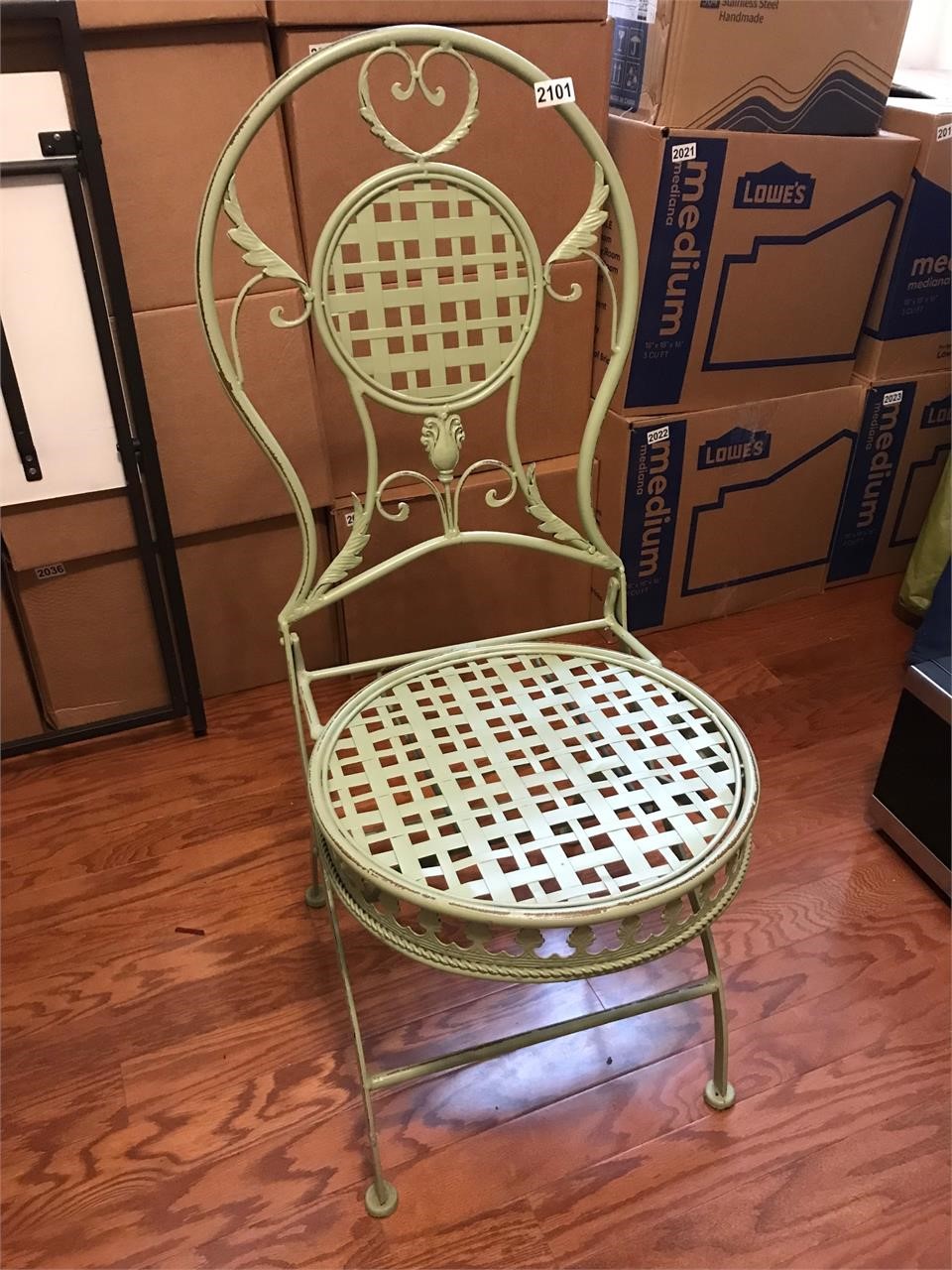 Wrought iron chair, soft green color