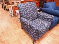 Blue upholstered recliner with foliage pattern by