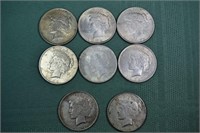 Eight 1922 US Peace silver dollars