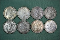 Eight US Morgan silver dollars: 1879, 1880O, 1881-