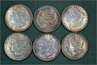 Six US Morgan silver dollars: (5) 1885, 1889