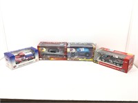 4 die cast model cars in original boxes.