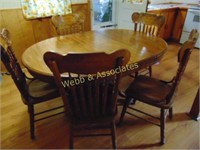Round oak table with leaf and five chairs