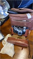 Argus camera in carrying case and camera bag with
