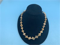 Beautiful necklace made from dark fossilized ivory