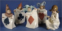 Four Neo playing card motif jester figurines