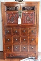 Oriental style two door over twelve drawer