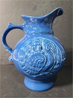 Stamped blue turkey ceramic pitcher