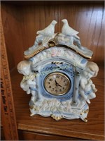 Quartz battery operated cherub clock