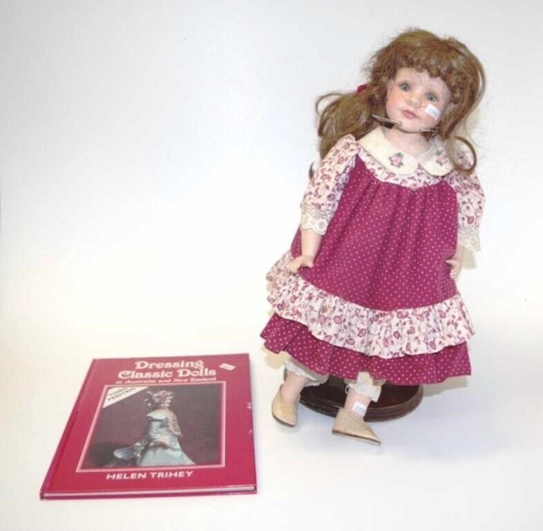 Vintage porcelain doll and book