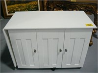 WHITE LAMINATE SEWING CABINET ON CASTERS
